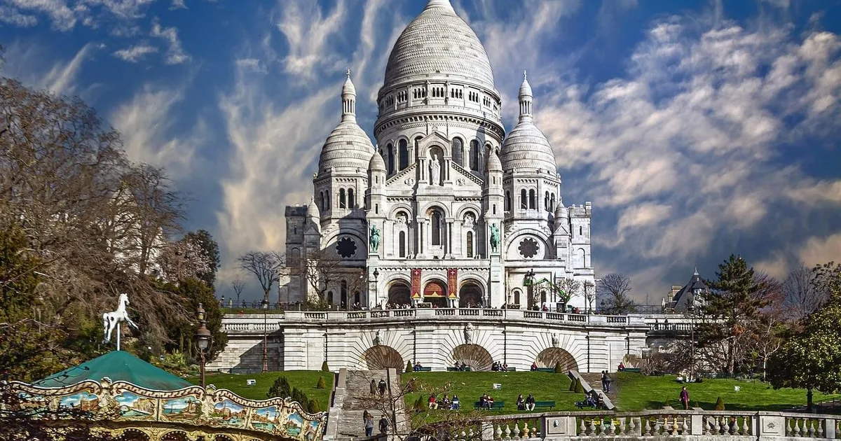 The Sacré-Cœur on its hill with a carousel below